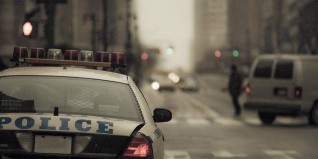 NYPD pulled over in New York City during light snow storm. Cinematic tones add to scene.