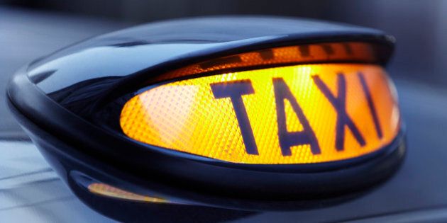 Close up of lit taxi sign