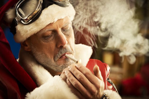 Portrait of Bad Santa smoking a joint