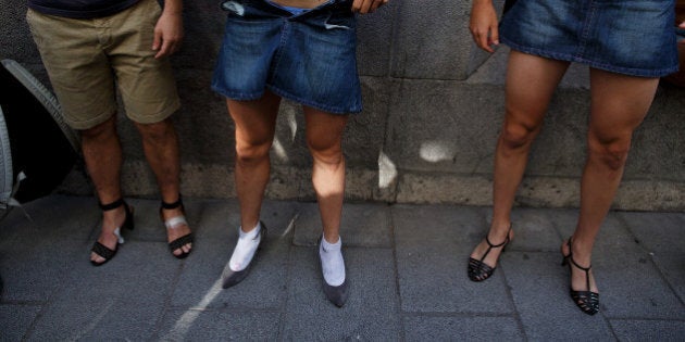 MADRID, SPAIN - JULY 03: Men wear high-heel shoes before the start of the annual high-heel race during Madrid Gay Pride celebrations in a street of Chueca on July 3, 2014 in Madrid, Spain. The winner of the race receives a prize of 500 Euros. (Photo by Pablo Blazquez Dominguez/Getty Images)
