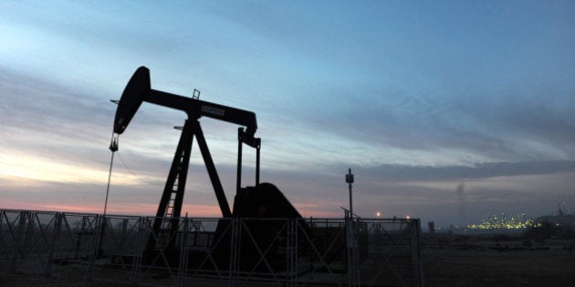 An oil pump operates in the Awali oil field in Bahrain on Wednesday, Jan. 5, 2011. Oil extended its biggest drop in seven weeks on signs that snowstorms in the U.S. curbed gasoline consumption in the world's biggest crude consumer. Photographer: Phil Weymouth/Bloomberg via Getty Images