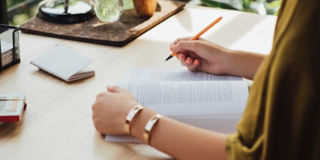 Caucasian woman studying at desk