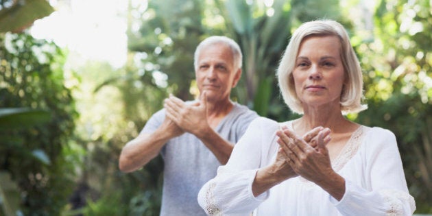 senior couple doing Tai Chi together