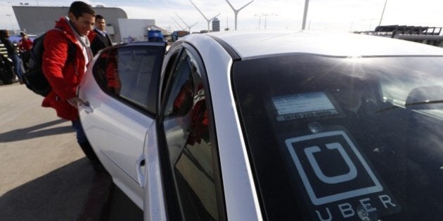 LOS ANGELES, CA - JANUARY 20, 2016: Ronit Belson from the Bay Area catches her UberX driver Dan Pedrovic as UberX begins making passenger pickups at Los Angeles International Airport on January 20, 2016 in Los Angeles, California. UberX joins competing service Lyft as the only such services offering pickups at LAX. (Photo by Al Seib / Los Angeles Times via Getty Images)