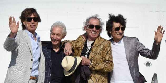 TOPSHOT - The Rolling Stones (L-R) Mick Jagger, Charlie Watts, Keith Richards and Ron Wood, are pictured upon landing in Montevideo on February 15, 2016, on the eve of their presentation within the America Latina Ole Tour. AFP PHOTO / PABLO PORCIUNCULA / AFP / PABLO PORCIUNCULA (Photo credit should read PABLO PORCIUNCULA/AFP/Getty Images)