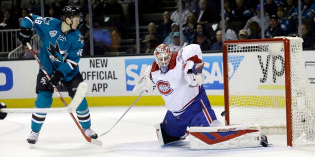 Montreal Canadiens goalie Mike Condon, right, is beaten for a goal on a shot by San Jose Sharks' Joe Pavelski, not seen, as Tomas Hertl (48) watches during the first period of an NHL hockey game Monday, Feb. 29, 2016, in San Jose, Calif. (AP Photo/Marcio Jose Sanchez)