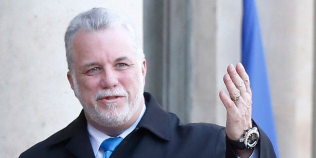 French President Francois Hollande, left, welcomes Quebec prime minister Philippe Couillard at the Elysee Palace in Paris, Monday, March 2, 2015. Philippe Couillard is on a five-day official visit in France. (AP Photo/Michel Euler)