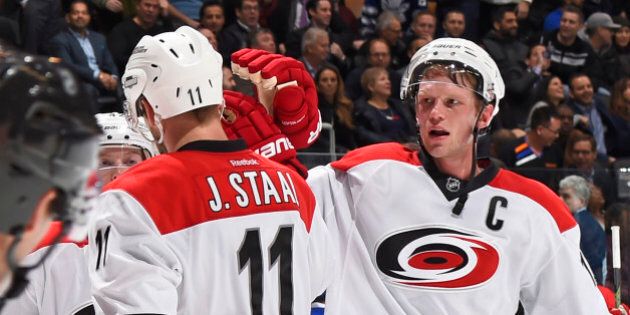 TORONTO, ON - JANUARY 21: Jordan Staal #11 and Eric Staal #12 of the Carolina Hurricanes celebrate the teams win over the Toronto Maple Leafs during NHL game action January 21, 2016 at Air Canada Centre in Toronto, Ontario, Canada. (Photo by Graig Abel/NHLI via Getty Images)