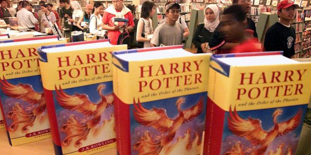 Malaysian readers queue up to buy the latest Harry Potter books by British author J.K. Rowling at a bookstore in Kuala Lumpur Saturday, June 21, 2003. Fans have waited three years for the latest Potter story, but have had two Potter movies to entertain them until the much anticipated release of