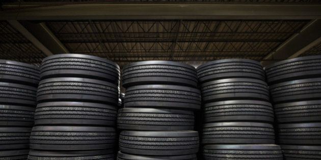 Bridgestone Corp. tires sit stacked at a warehouse in Nashville, Tennessee, U.S., on Tuesday, Dec. 29, 2015. Pep Boys shares jumped 8.8 percent after Carl Icahn raised his takeover offer for the auto-parts chain to more than $1 billion, escalating a bidding war with Bridgestone. Photographer: Joe Buglewicz/Bloomberg via Getty Images