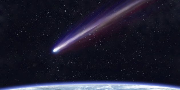Illustration of a comet flying through space close to the earth