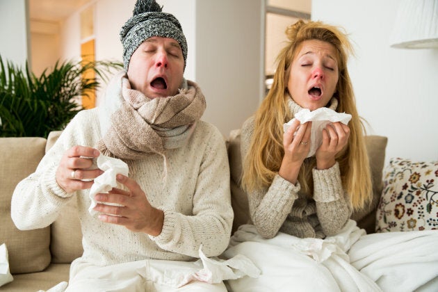 Sick couple catch cold. Man and woman sneezing, coughing. People got flu, having runny nose.