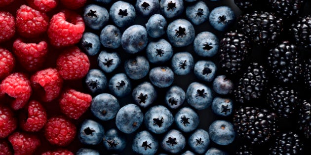 áolorful flag with fruits of the forest