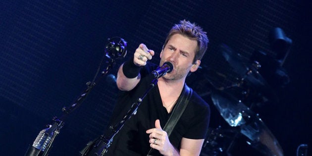 AUSTIN, TX - APRIL 04: Chad Kroeger of Nickelback performs in concert at the Austin360 Amphitheater on April 4, 2015 in Austin, Texas. (Photo by Gary Miller/Getty Images)