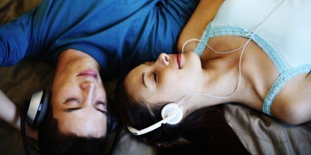 Young Couple Listening to MP3 Player
