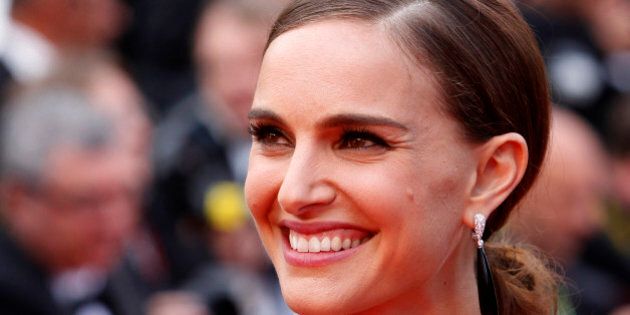 Actress Natalie Portman poses for photographers as she arrives for the screening of the film Sicario at the 68th international film festival, Cannes, southern France, Tuesday, May 19, 2015. (AP Photo/Lionel Cironneau)