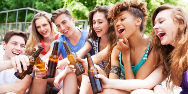 Friends toasting with beer