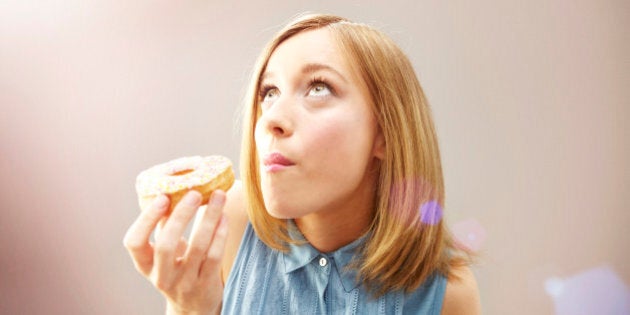 girl eating donut