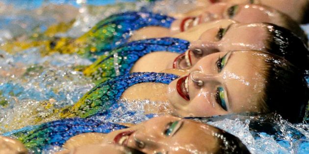 Members of Canada's synchronized swimming team perform during technical routine competition for the Pan Am Games in Toronto, Thursday, July 9, 2015. (AP Photo/Gregory Bull)