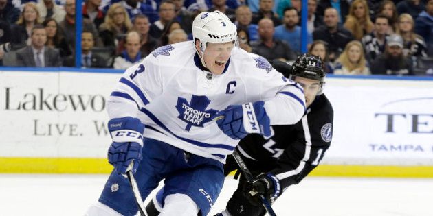 Toronto Maple Leafs defenseman Dion Phaneuf (3) grimaces after getting slashed by Tampa Bay Lightning center Cedric Paquette (13) during the second period of an NHL hockey game Wednesday, Jan. 27, 2016, in Tampa, Fla. Paquette was penalized on the play. (AP Photo/Chris O'Meara)