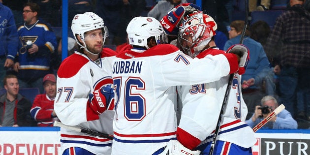 ST. LOUIS, MO - FEBRUARY 24: Tom Gilbert #77 and P.K. Subban #76 of the Montreal Canadiens congratulate Carey Price #31 of the Montreal Canadiens after beating the St. Louis Blues at the Scottrade Center on February 24, 2015 in St. Louis, Missouri. (Photo by Dilip Vishwanat/NHLI via Getty Images)