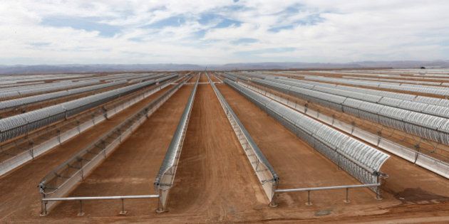 Construction of Morocco's Noor I solar power plant, is nearing completion near Ouarzazate, Morocco, Friday April, 24, 2015 . The facility will use parabolic mirrors to catch the sun's rays to heat a salt solution and drive steam turbines to create power. (AP Photo/Abdeljalil Bounhar)