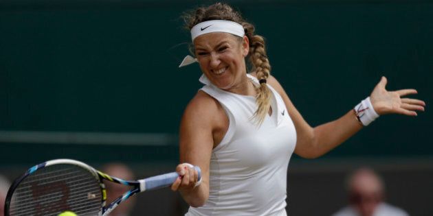 Victoria Azarenka of Belarus makes a return to Serena Williams of the United States during their singles match at the All England Lawn Tennis Championships in Wimbledon, London, Tuesday July 7, 2015. (AP Photo/Pavel Golovkin)