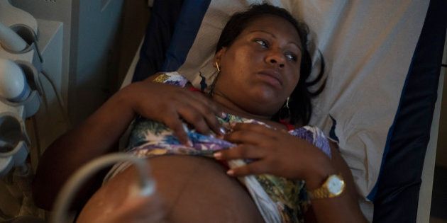 Geovania do Nascimento, who is almost nine months pregnant, undergoes an ultrasound scan at the IMIP hospital in Recife, Pernambuco state, Brazil, Wednesday, Feb. 3, 2016. Brazil is in the midst of a Zika virus outbreak, spread by the Aedes aegypti mosquito, which is well-adapted to humans, thrives in people's homes and can breed in even a bottle cap's-worth of stagnant water. The virus is suspected to be linked with occurrences of microcephaly in new born babies. (AP Photo/Felipe Dana)