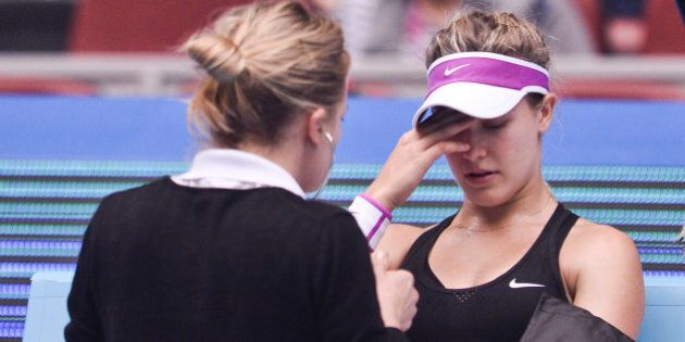 BEIJING, CHINA - OCTOBER 05: (CHINA OUT) Eugenie Bouchard of Canada receives treatment during the match against Andrea Petkovic of Germany during day three of the 2015 China Open at the China National Tennis Centre on October 5, 2015 in Beijing, China. (Photo by ChinaFotoPress/ChinaFotoPress via Getty Images)