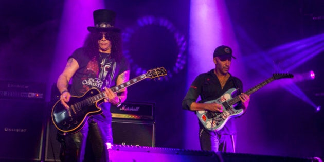 Slash and Tom Morello perform with Ozzy Osbourne at the Voodoo Music Experience on Saturday, Oct. 31, 2015, in New Orleans. (Photo by Barry Brecheisen/Invision/AP)