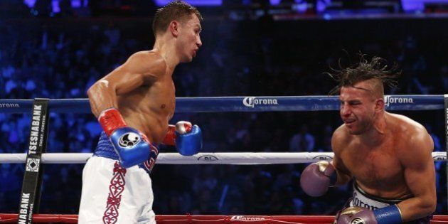 Gennady Golovkin, left, knocks David Lemieux into the ropes in the eighth round of a middleweight title fight at Madison Square Garden in New York on Saturday, Oct. 17, 2015. Golovkin in the eighth round.(AP Photo/Rich Schultz)