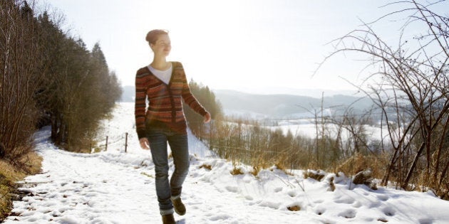 Woman walking on a snowy path