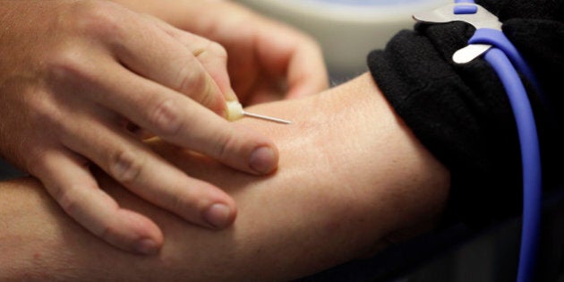 In this Aug. 20, 2013, photo, technician Greg Snyder, left, inserts a needle into a vein on Gina Hohenstaff's arm as she donates blood in an Indiana Blood Center Bloodmobile in Indianapolis. The nationâs blood-collection system has undergone a dramatic change from just a decade ago, when agencies that oversee the blood supply worried whether they could keep up with the needs of an aging population. Now, blood banks are making fewer but more targeted appeals for donations and reducing the size of their operations. (AP Photo/Michael Conroy)