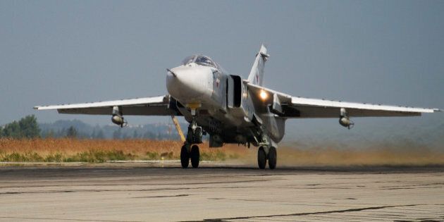 FILE - In this Oct. 22, 2015 file photo, a Russian Su-24 takes off on a combat mission at Hemeimeem airbase in Syria. Turkey said Saturday Jan. 30, 2016 that a Russian warplane SU-34 has again violated its airspace despite several warnings â two months after Turkey's military shot down a Russian jet for crossing over its territory. (AP Photo/Vladimir Isachenkov, File)