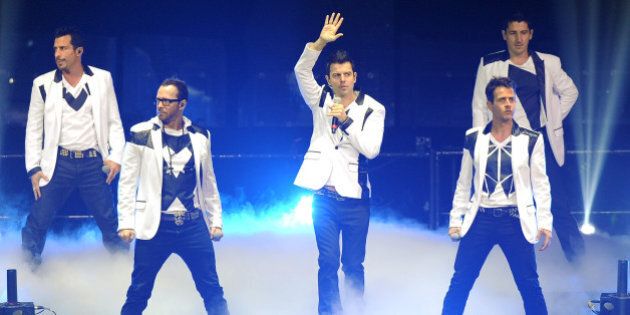 Danny Wood, Joey McIntyre, Donnie Wahlberg, Jordan Knight, and Jonathan Knight of New Kids on the Block perform during the Package Tour 2013 at the BB&T Center on June 22, 2013 in Ft Lauderdale, Florida. (Photo by Jeff Daly/Invision/AP)