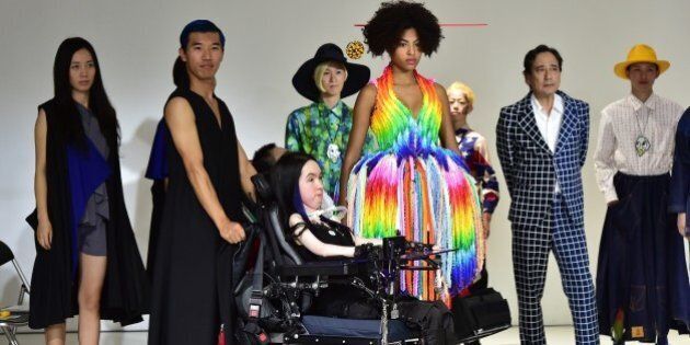 Models pose during Japanese designer Takafumi Tsuruta's 'tenbo' 2016 spring/summer collection in Tokyo on October 13, 2015, during Tokyo fashion week. Tsuruta designed the line of outfits for all people, including those with disabilities. AFP PHOTO / Yoshikazu TSUNO (Photo credit should read YOSHIKAZU TSUNO/AFP/Getty Images)