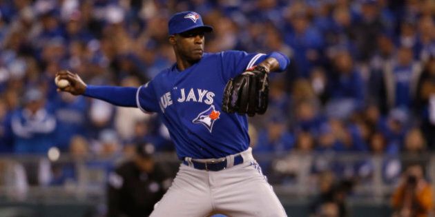 Toronto Blue Jays relief pitcher LaTroy Hawkins throws against the Kansas City Royals during the eighth inning in Game 1 of baseball's American League Championship Series on Friday, Oct. 16, 2015, in Kansas City, Mo. (AP Photo/Matt Slocum)