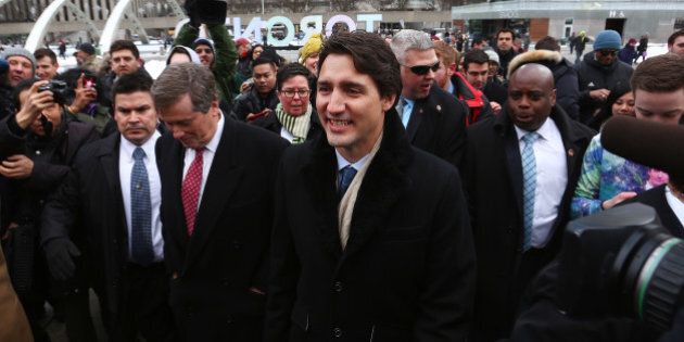 Justin Trudeau, Canada's prime minister, center right, and John Tory, mayor of Toronto, center left, arrive for a press conference at Toronto City Hall in Toronto, Ontario, Canada, on Wednesday, Jan. 13, 2016. 'The government's concern is to create economic growth and opportunity for success,' Trudeau said. Photographer: Cole Burston/Bloomberg via Getty Images