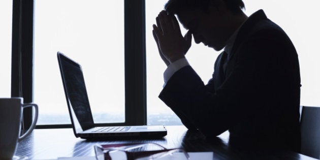 Stressed businessman in the office.