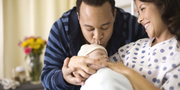 Mother and father with newborn infant