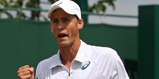 Canada's Vasek Pospisil celebrates winning a point against Serbia's Viktor Troicki during their men's singles fourth round match on day seven of the 2015 Wimbledon Championships at The All England Tennis Club in Wimbledon, southwest London, on July 6, 2015. RESTRICTED TO EDITORIAL USE -- AFP PHOTO / JUSTIN TALLIS (Photo credit should read JUSTIN TALLIS/AFP/Getty Images)