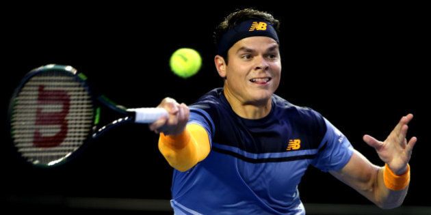Milos Raonic of Canada plays a forehand return to Andy Murray of Britain during their semifinal match at the Australian Open tennis championships in Melbourne, Australia, Friday, Jan. 29, 2016.(AP Photo/Rick Rycroft)