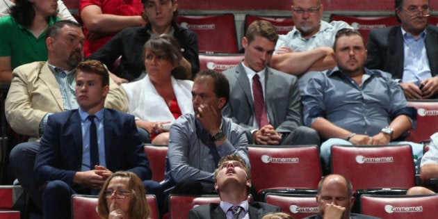 SUNRISE, FL - JUNE 27: Attendees show a range of emotions during the final round of the 2015 NHL Draft at BB&T Center on June 27, 2015 in Sunrise, Florida. (Photo by Bruce Bennett/Getty Images)