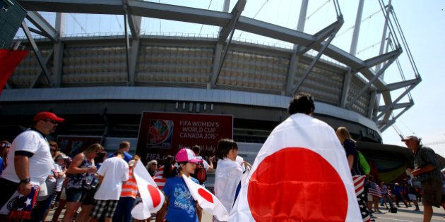 VANCOUVER, BC - JULY 05: A fan of Japan stands outside BC Place Stadium before Japan takes on the United States in the FIFA Women's World Cup Canada 2015 Final on July 5, 2015 in Vancouver, Canada. (Photo by Ronald Martinez/Getty Images)