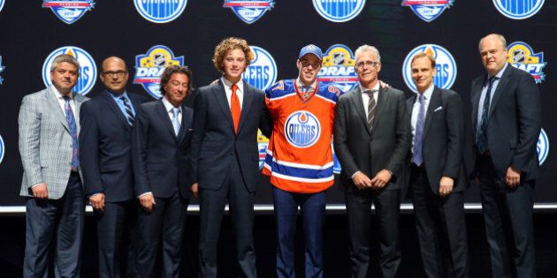 SUNRISE, FL - JUNE 26: Connor McDavid poses on stage after being selected first overall by the Edmonton Oilers in the first round of the 2015 NHL Draft at BB&T Center on June 26, 2015 in Sunrise, Florida. (Photo by Bruce Bennett/Getty Images)