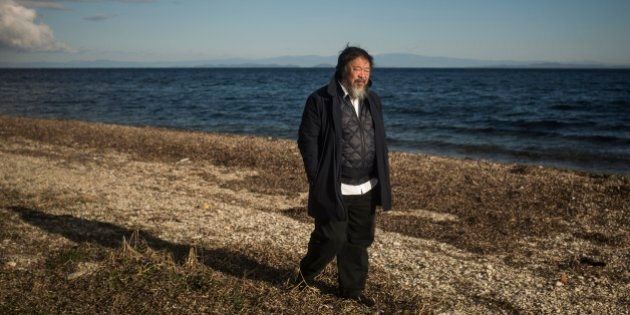 Chinese activist and artist Ai Weiwei walks on a beach next to the town of Mytilini, on the Greek island of Lesbos, Friday, Jan. 1, 2016. The Chinese artist visited the island of Lesbos in solidarity with refugees and migrants who continue to arrive on a daily basis hoping to make their way into Europe. (AP Photo/Santi Palacios)