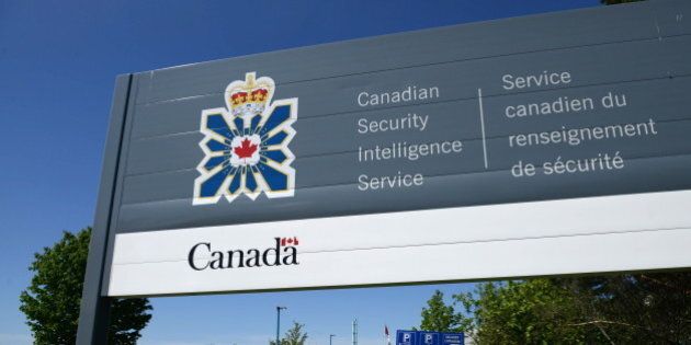 A sign for the Canadian Security Intelligence Service building is shown in Ottawa, Tuesday, May 14, 2013. Canada's spy agency clandestinely watched a navy officer pass top secret information to Russia for months without briefing the RCMP - a previously unknown operation that raises questions about whether Jeffrey Delisle could have been arrested sooner. THE CANADIAN PRESS/Sean Kilpatrick