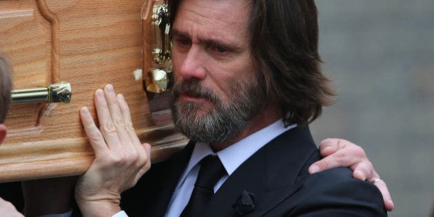 Actor Jim Carrey, carries the coffin of his ex-girlfriend Cathriona White as they walk to Our Lady of Fatima Church, in her home village of Cappawhite, Co Tipperary, Ireland, ahead of her funeral, Saturday Oct. 10, 2015. The 30-year-old make-up artist was found dead in a house in Sherman Oaks, California, on September 28. (AP Photo)