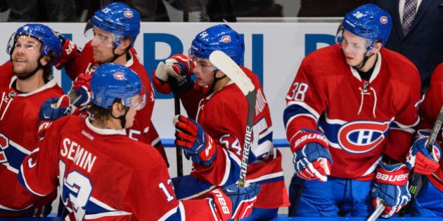 QUEBEC CITY, QC - SEPTEMBER 28: Alexander Semin #13 of the Montreal Canadiens celebrates his goal with teammates on the bench during an NHL pre-season game against the Pittsburgh Penguins at the Videotron Centre on September 28, 2015 in Quebec City, Quebec, Canada. (Photo by Minas Panagiotakis/Getty Images)