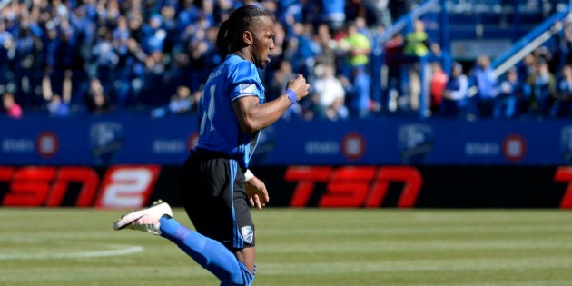 Apr 30, 2016; Montreal, Quebec, CAN; Montreal Impact forward Didier Drogba (11) reacts after scoring a goal against the Colorado Rapids during the first half at Stade Saputo. Mandatory Credit: Eric Bolte-USA TODAY Sports